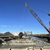 A dredging vessel fills a barge with material pulled from the bottom of the Cuyahoga River, Cleveland, Ohio, Nov. 15, 2023. (Photo: Dave Bala / U.S. Army)