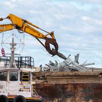 Debris removed from the Patapsco River is loaded onto a barge for removal by response personnel. The Unified Command is working to restore flow of critical commerce in and out of Baltimore. (Key Bridge Response 2024 Unified Command photo by Dylan Burnell, USACE.)