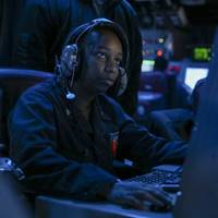 Sept. 20, 2022: Operations Specialist 2nd Class Quiana Jordan, from East Orange, New Jersey, stands tactical information coordinator watch in the combat information center of the guided-missile destroyer USS Higgins (DDG 76) transits through the Taiwan Strait. (U.S. Navy photo by Mass Communication Specialist 1st Class Donavan K. Patubo)